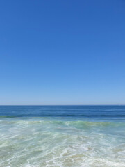sea and clear blue sky with space for text