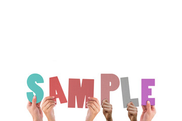 Colorful alphabet spelling sample held up by people 