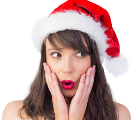Festive brunette looking surprised with hands on face