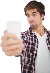 Rolgordijnen Hipster making face while taking selfie © vectorfusionart