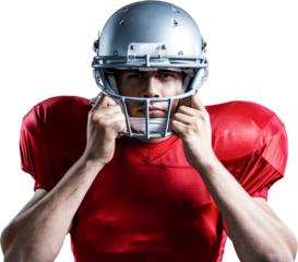 Portrait of American football player holding helmet