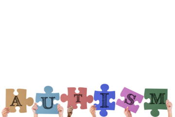 Hands holding up autism jigsaw pieces