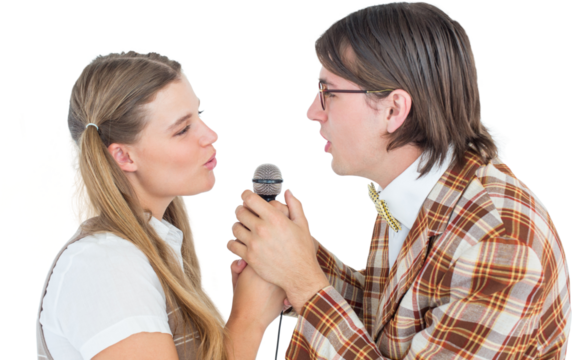 Happy geeky hipsters singing with microphone