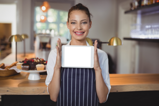 Portrait of waitress holding digital tablet at counter - Powered by Adobe