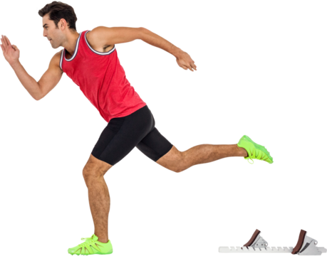 Confident male athlete running from starting blocks