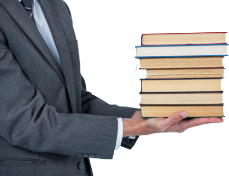 Mid section of businessman holding books