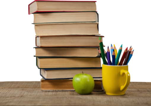 Stack of books by colored pencils in mug and apple on wooden table