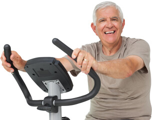 Portrait of a happy senior man on stationary bike