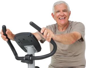 Portrait of a happy senior man on stationary bike
