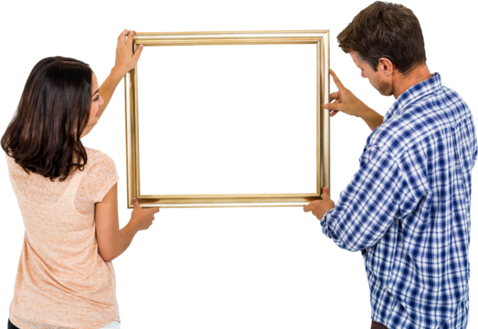 Couple holding picture frame