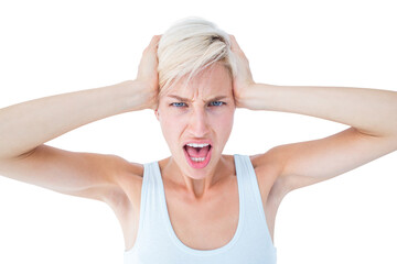 Angry woman screaming and holding her head 