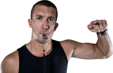 Portrait of attentive trainer blowing his whistle