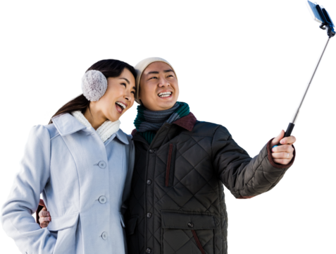 Couples taking funny pictures using smartphone