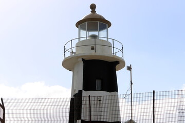 A lighthouse is a navigational landmark that is used to identify coasts and locate ships.