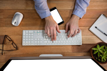 Overhead view of businesswoman working on computer