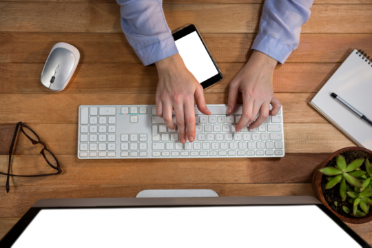Overhead view of businesswoman working on computer - Powered by Adobe