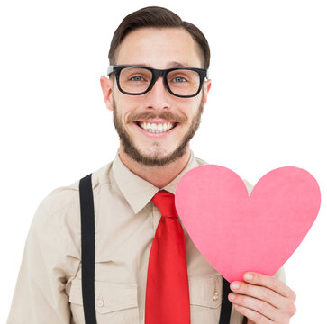 Geeky hipster smiling and holding heart card