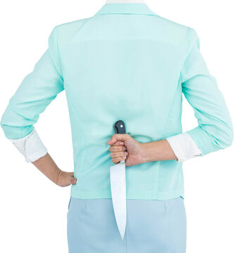 Rear view of businesswoman hiding knife