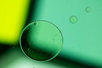 Macro close up of water bubbles with copy space on green background