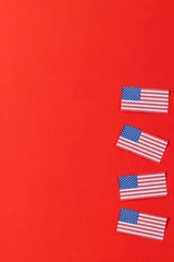 Foto op Plexiglas Centraal-Amerika  High angle view of four flags of united states of america with copy space on red background