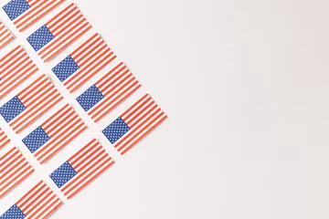 Fotobehang Centraal-Amerika  High angle view of rows of flags of united states of america with copy space on white background