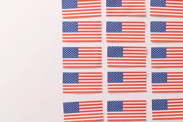 Foto op Plexiglas Centraal-Amerika  High angle view of rows of flags of united states of america with copy space on white background