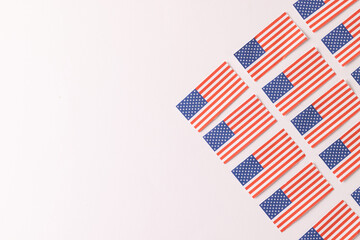 High angle view of rows of flags of united states of america with copy space on white background