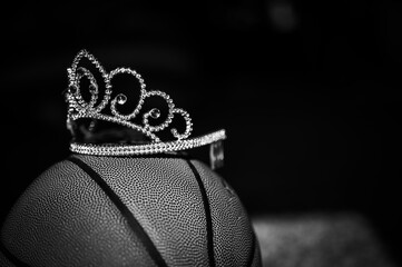 Basketball, tiara, and blank bracket signifying a Cinderella season.