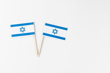 Close up of two flags of israel with copy space on white background