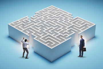 Businessman trying to find a way out of maze