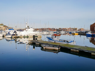 Fototapeta premium Boats in the old town of Weymouth Harbour and Weymouth Marina in Dorset, England, UK