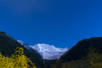 beautiful snow mountain in blue sky ans clouds, Rakaposhi also known as Dumani is a mountain of the Karakoram range, 