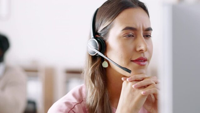 Business woman, call center and face consulting in customer service, telemarketing or support at the office. Serious female consultant or agent talking with headphones on computer for online advice