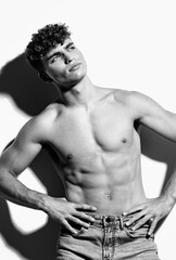 Fototapeta premium man fashion healthy beautiful sport strong beauty torso jeans white bodybuilder fitness black and white