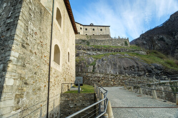 Bard, Italy. View of the path leading to the Forte di Bard, an ancient military fortress located at the entrance to the Aosta Valley, a few kilometers from the border with Piedmont. 2023-03-25.