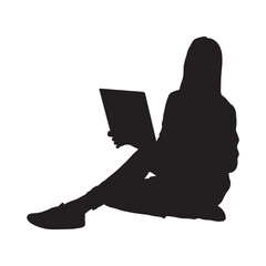 Girl sitting on floor and working on laptop side view silhouette.