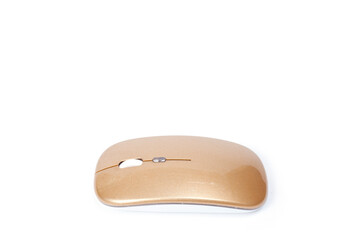 Wireless mouse of golden color for a computer or laptop.