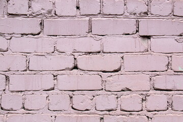 Brick wall painted in bright colors.