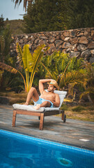 boy relaxing un the pool