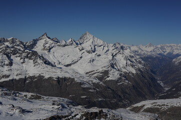 mountain peak  in Alps in winter with snow and clear blue sky. Beautiful and magnificent landscape on a sunny day