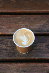 Morning Latte Coffee In A Craft Cup With Pattern On The Foam On A Wood Surface 