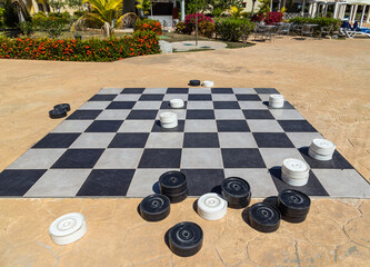 Checkers game, black and white pieces. Game for intelligenc and strategy.
