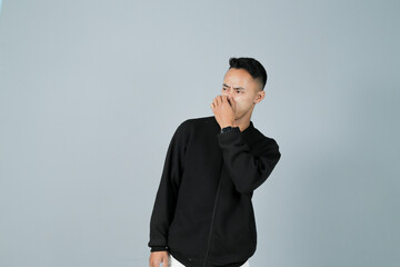 a young man wearing a black shirt