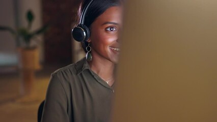 Business woman, call center and consulting at night with headphones on computer in customer service or support. Happy female consultant agent working late talking on PC for online advice at workplace
