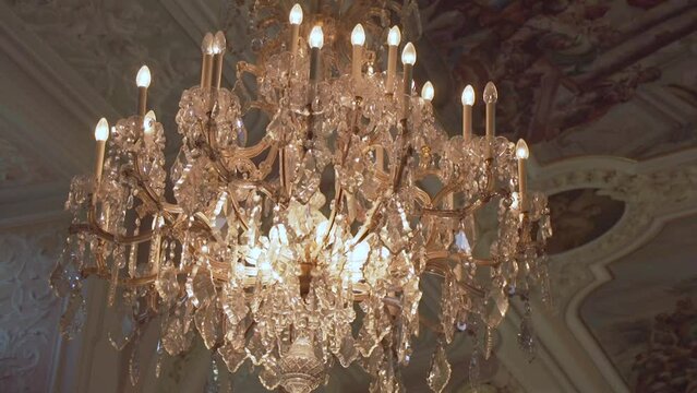 chandelier and spes and veritas lettering in baroque dining room in monastery