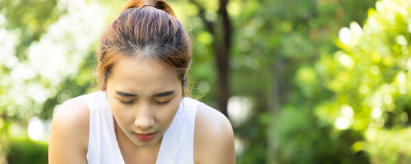 Tired fitness woman panting after hard working out, header crop