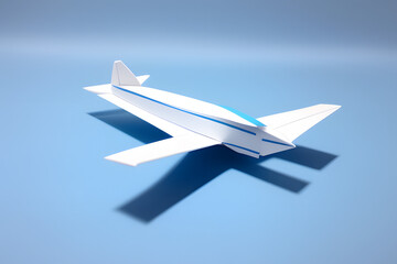 Handmade light blue paper plane isolated on white