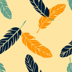 Feathers on yellow background seamless vector pattern