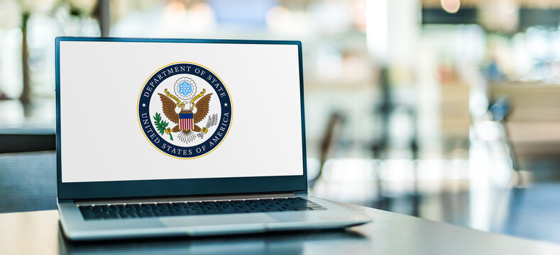 Laptop displaying logo of State Department