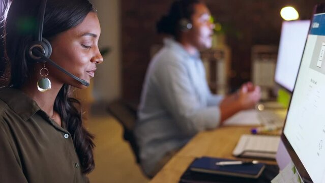 Call center, communication or friendly Indian woman consulting, explaining or talking at customer support. Computer, night or sales consultant in telemarketing or telecom company with helping advice